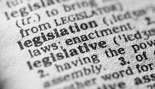 Close up photograph of the page of a dictionary focused on the word legislation